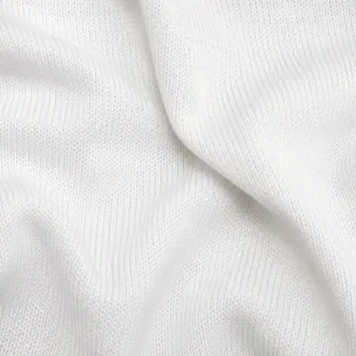 Extreme close-up of chalk white cotton lisle sock knit.