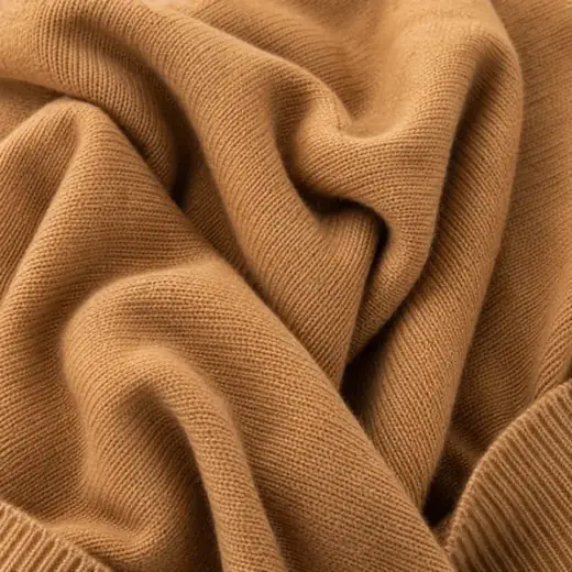 Extreme close-up of camel coloured cashmere knit.